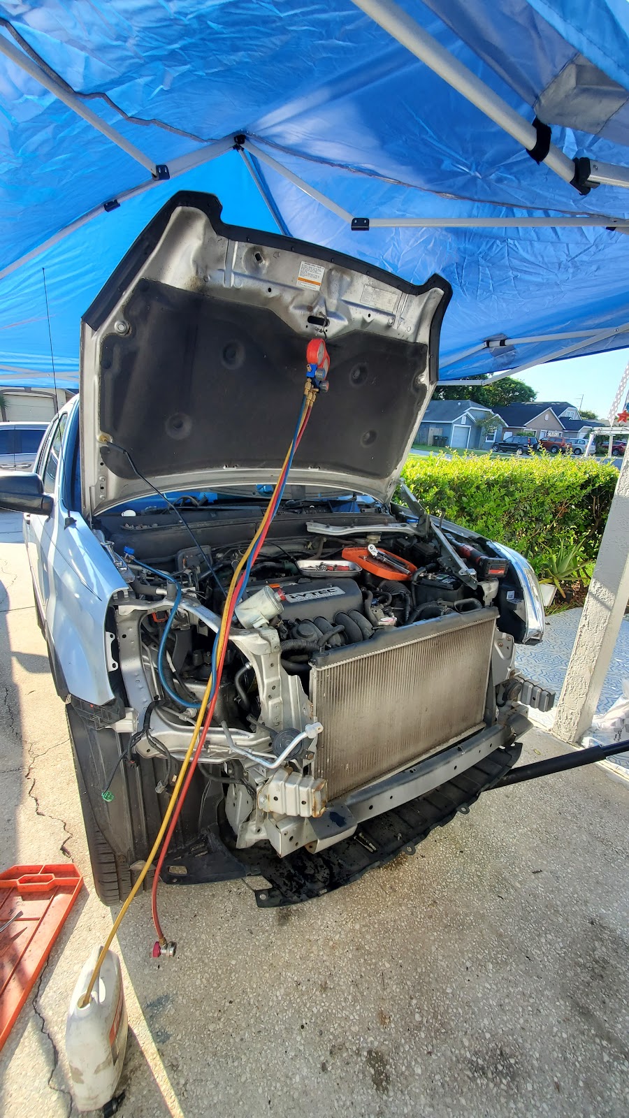 Vehicle being serviced with hood open